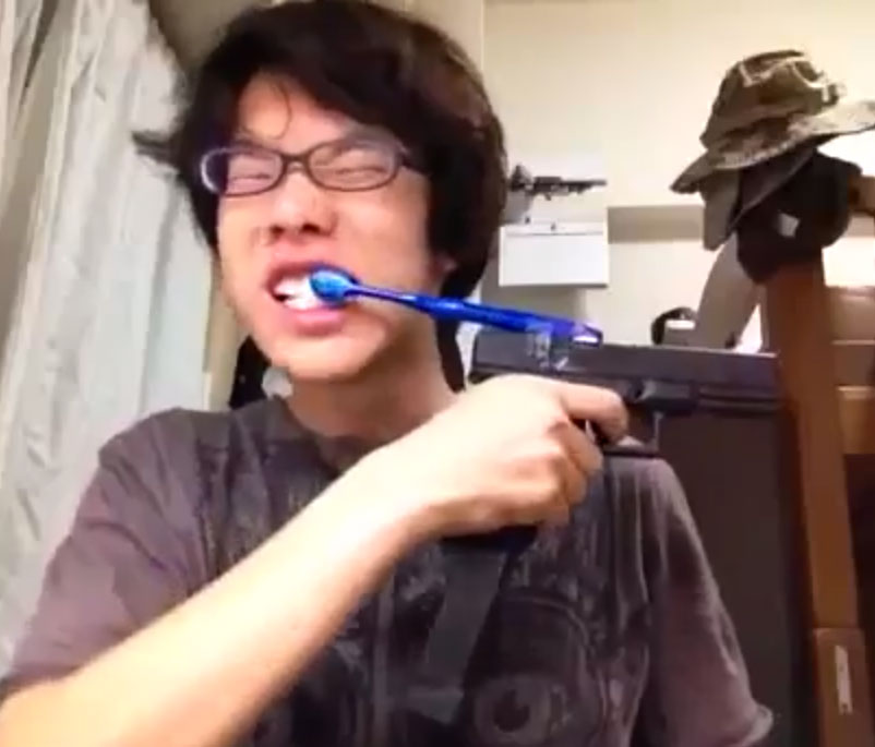 Asian-Kid-Glock-Toothbrush